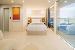 מיטה או מיטות בחדר ב-Haeilri Pool&SPA Hotel