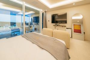 TV a/nebo společenská místnost v ubytování Haeilri Pool&SPA Hotel