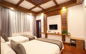 Tempat tidur dalam kamar di Easy House Gaoyun Branch