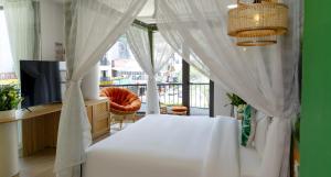 Tempat tidur dalam kamar di Tropical Paradise Sapa Hotel & Coffee