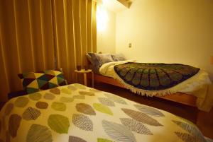 um quarto com duas camas num quarto em KITAZAWA CS HOUSE / Vacation STAY 68573 em Tóquio