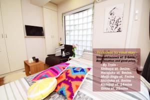 a bedroom with a bed with a sign on it at KITAZAWA CS HOUSE / Vacation STAY 76588 in Tokyo