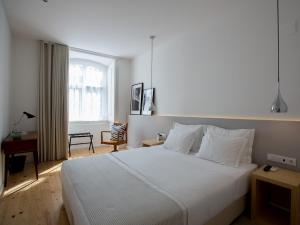 Cama o camas de una habitación en The 8 - Downtown Suites