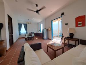 a living room with a couch and a table at La nho House in Ninh Hải