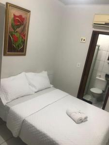 Postel nebo postele na pokoji v ubytování Pousada Central