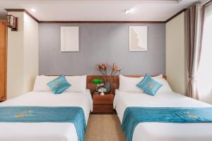 Ένα ή περισσότερα κρεβάτια σε δωμάτιο στο Thao Minh New Star Hotel