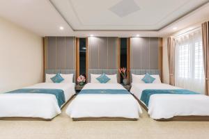Ένα ή περισσότερα κρεβάτια σε δωμάτιο στο Thao Minh New Star Hotel