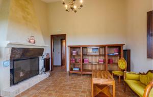 a living room with a fireplace and a couch at Casa La Tana Della Lepre in Cingoli