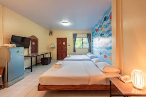 Katil atau katil-katil dalam bilik di Sawasdee Place +76 gambar