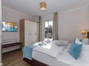 En eller flere senge i et værelse på Beach holiday Comfortable holiday residence + 19 billeder