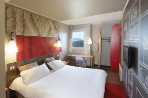 Ένα ή περισσότερα κρεβάτια σε δωμάτιο στο ibis Saint Brieuc Yffiniac +67 φωτογραφίες