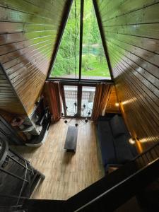 an overhead view of a room with a large window at Cabana Zimbru Transfagarasan in Arefu