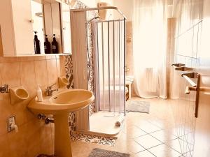 a bathroom with a shower and a sink and a shower at Domus Angela in Polignano a Mare +18 photos