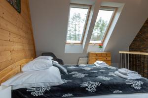 Posteľ alebo postele v izbe v ubytovaní Biathlon Park - Apartament VIP