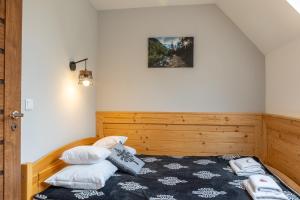 Posteľ alebo postele v izbe v ubytovaní Biathlon Park - Apartament VIP