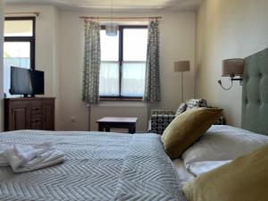 Letto o letti in una camera di Wellness Pension 7
