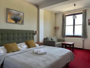 Letto o letti in una camera di Wellness Pension 7