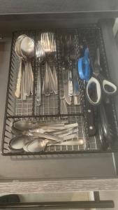a drawer filled with utensils in a refrigerator at A quiet haven in the city in Birmingham