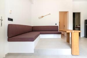 a couch and a table in a room at ASTRA in Parga