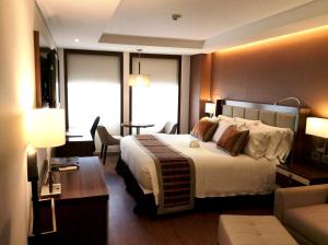 Postel nebo postele na pokoji v ubytování Hotel Dann Carlton Bogota