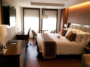 Postel nebo postele na pokoji v ubytování Hotel Dann Carlton Bogota