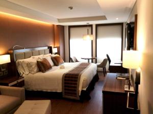 Postel nebo postele na pokoji v ubytování Hotel Dann Carlton Bogota