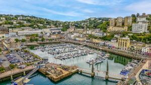 an aerial view of a harbor with boats in the water at The Moorings - Duplex apartment on Torquay Marina with Hot Tub in Torquay