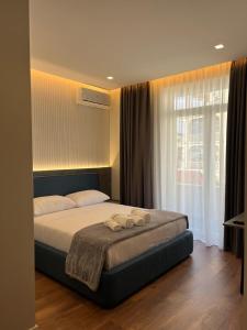 Postel nebo postele na pokoji v ubytování North Alb Hotel