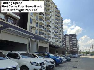 a row of cars parked in front of a building at 316 Tower 3 Avida Atria Iloilo Pool View Comfy Cozy Central in Iloilo City