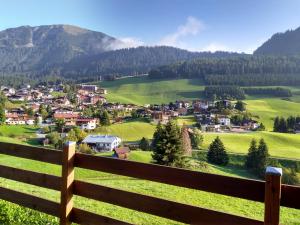 a view of a village from a fence at Häus`l am Ruan in Berwang