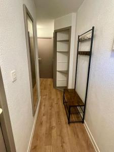a hallway with a mirror and a dressing room at SAS Vac Appart in Talmont +14 photos