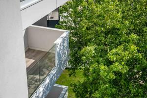 an external view of a house with a glass staircase at Zero5.Zero5 in Lignano Sabbiadoro