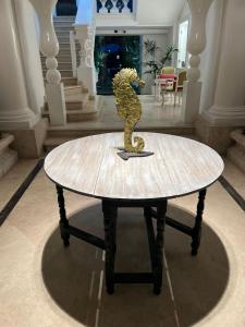 a table with a dinosaur statue on top of it at Relais Corte Degli Aragonesi in Ischia
