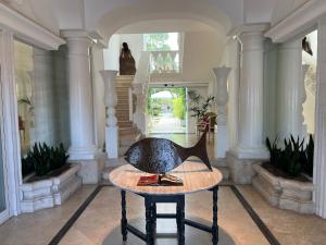 a room with a table with a duck on it at Relais Corte Degli Aragonesi in Ischia