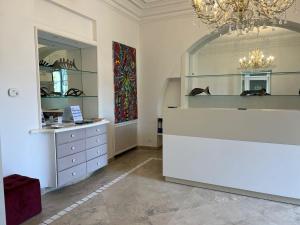 a dressing room with a dresser and a mirror at Relais Corte Degli Aragonesi in Ischia