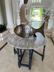 a sculpture of a fish on a table in a room at Relais Corte Degli Aragonesi in Ischia