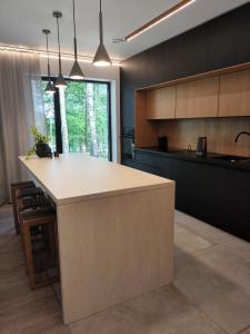 a kitchen with a large island in the middle at Cieślówka in Leżajsk +75 photos