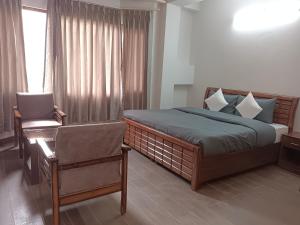 Katil atau katil-katil dalam bilik di Rudra Darshan Bed & Breakfast