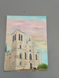 a painting of a church with a sky at Appart’hôtel L’aiglon in Saint-Claude
