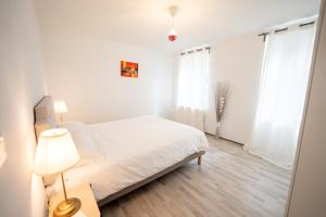 Posteľ alebo postele v izbe v ubytovaní Villa Vichéia - Appartement 3