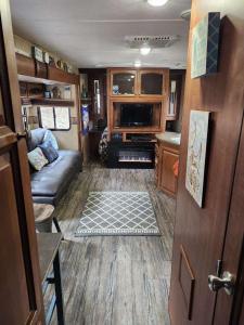 a living room in an rv with a couch at Rv adventure Roscoe Pet friendly in Roscoe