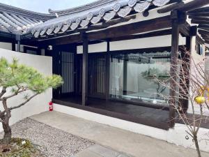 an external view of a house with a roof at Hanok Dasi Bom 102 in Gyeongju