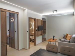 a living room with a couch and a table at Four Elements in Tsagarada
