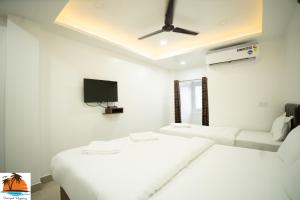 Sampat Regency客房内的一张或多张床位