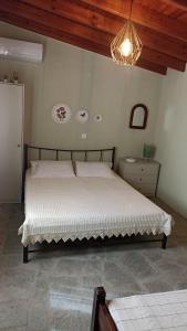 Ένα ή περισσότερα κρεβάτια σε δωμάτιο στο Anna’s Olive Grove