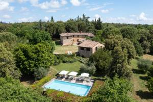 an aerial view of a house with a swimming pool at Borgo dei Fondi in Siena
