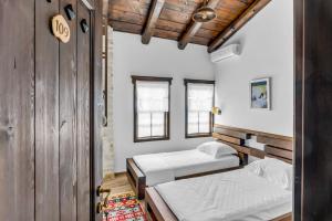 Voodi või voodid majutusasutuse Hotel Bohem Berat toas
