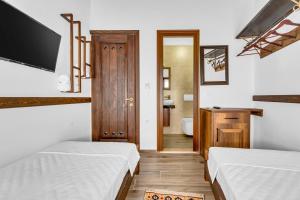 Voodi või voodid majutusasutuse Hotel Bohem Berat toas