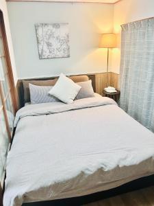 Katil atau katil-katil dalam bilik di 天下茶屋駅5分、専用庭付き平屋—KIK Iハウス