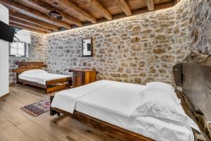 Voodi või voodid majutusasutuse Hotel Bohem Berat toas